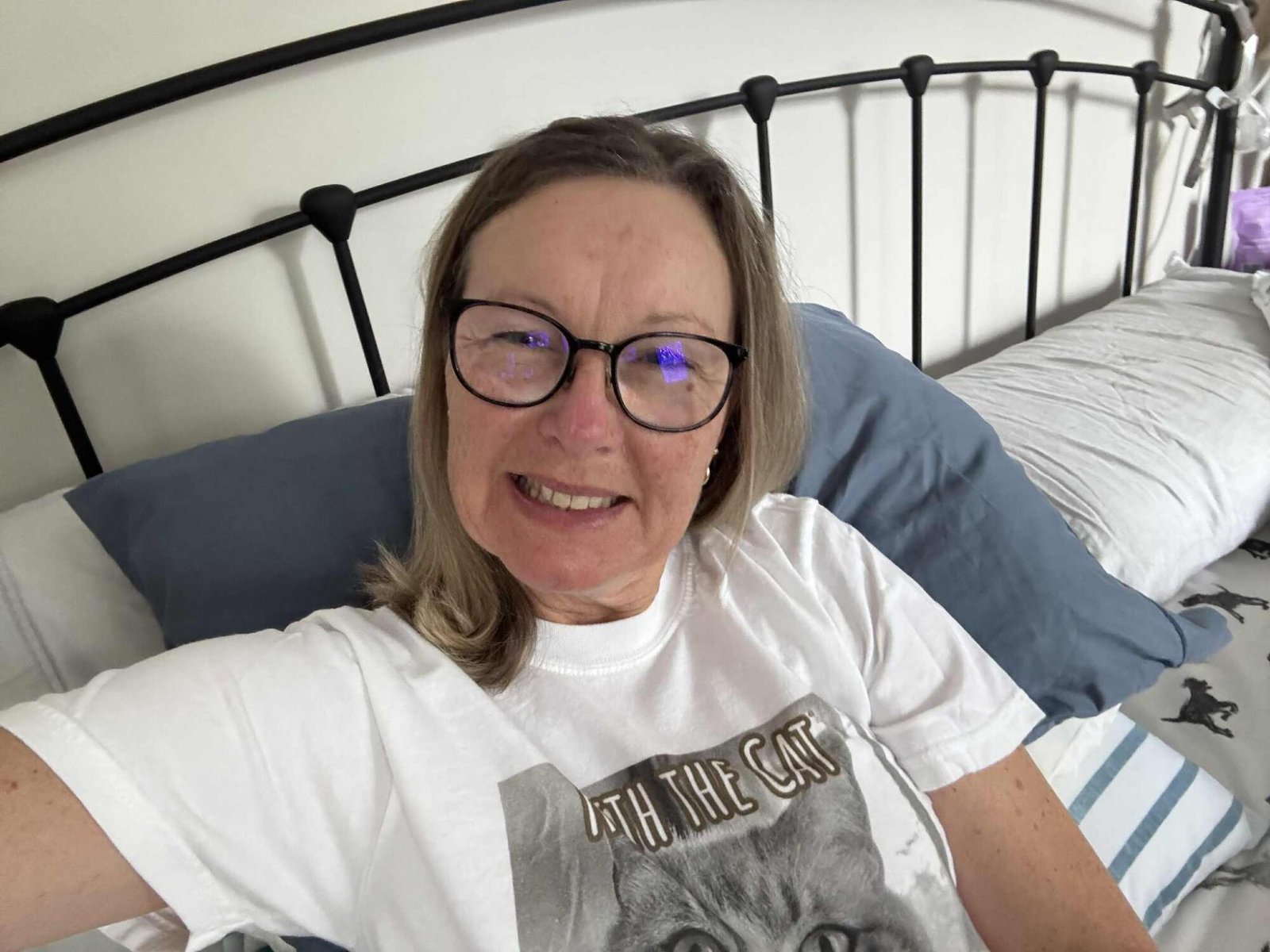 Woman wearing her Keith the Cat shirt.