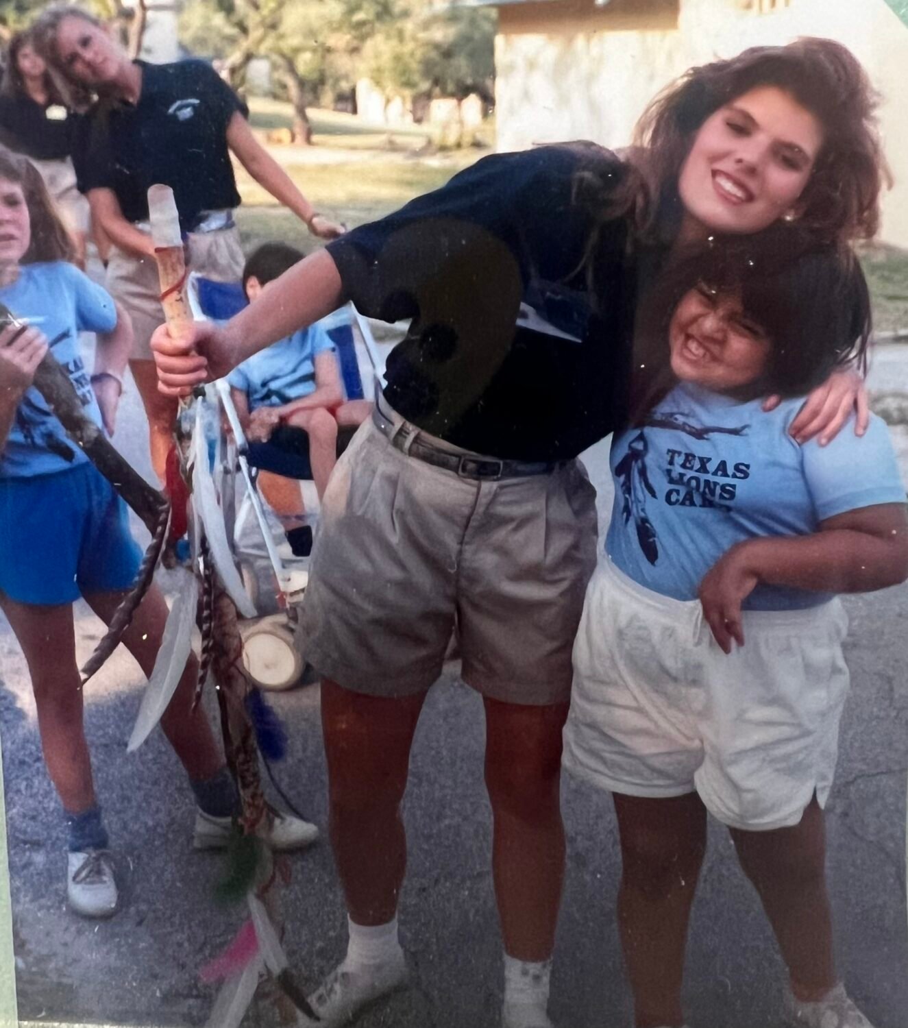 Counselor Liz hugging a camper.